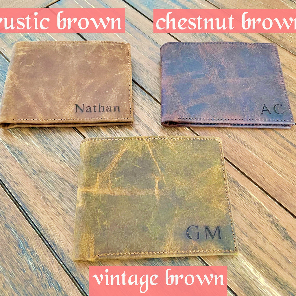 Three leather wallets in rustic brown, chestnut brown, and vintage brown on a wooden surface.