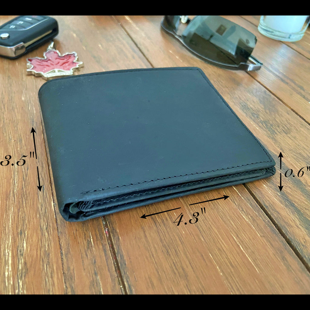 Black wallet on a wooden surface with measurements indicated
